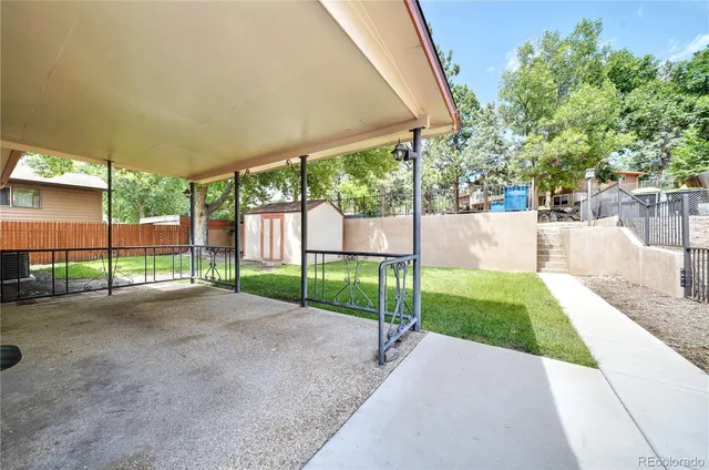 a view of a backyard with a garden and plants