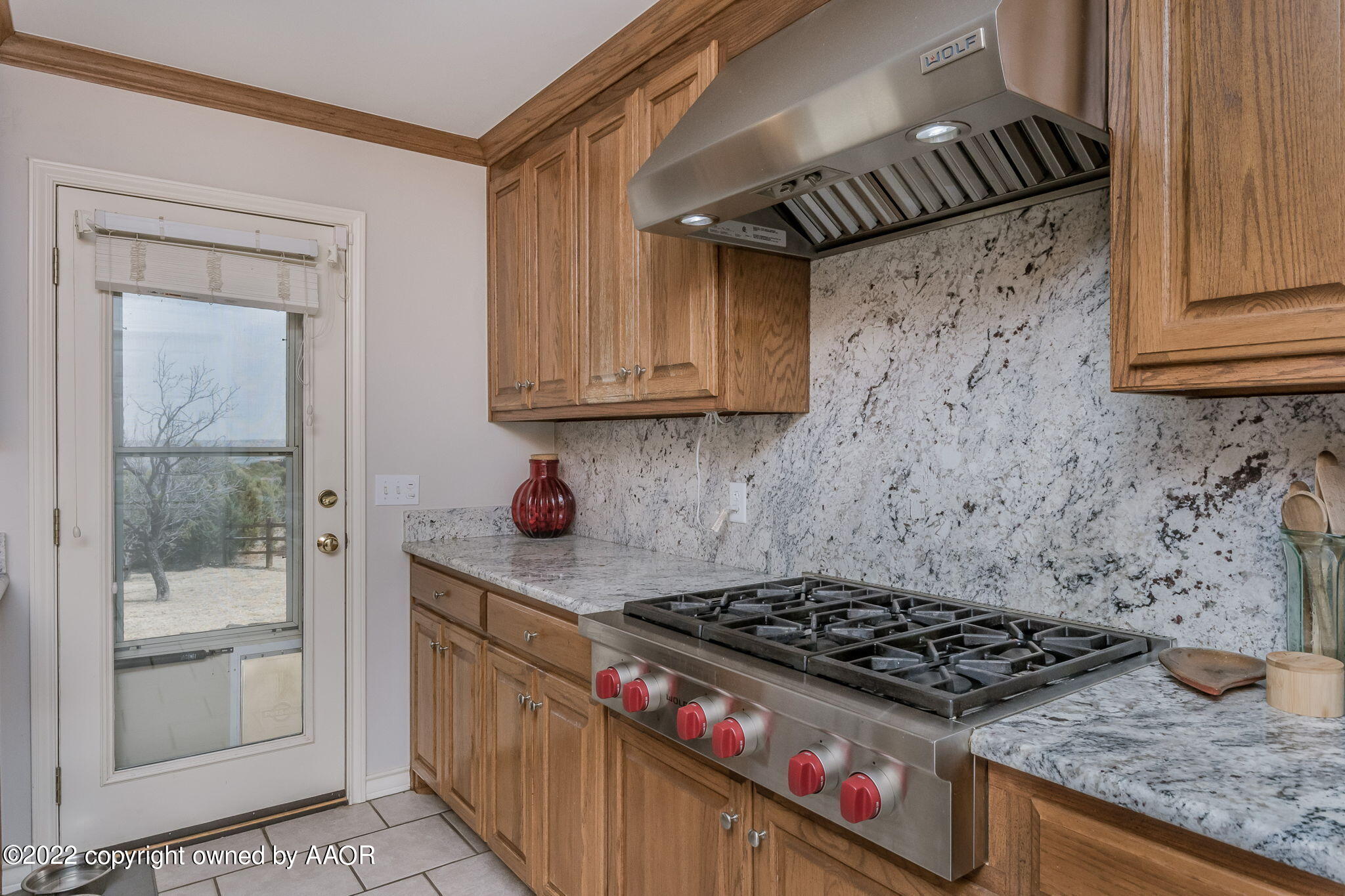 327 Lake Ridge Road Canyon, TX 79015 - Photo 11 of 31 a kitchen with granite countertop a stove and a sink