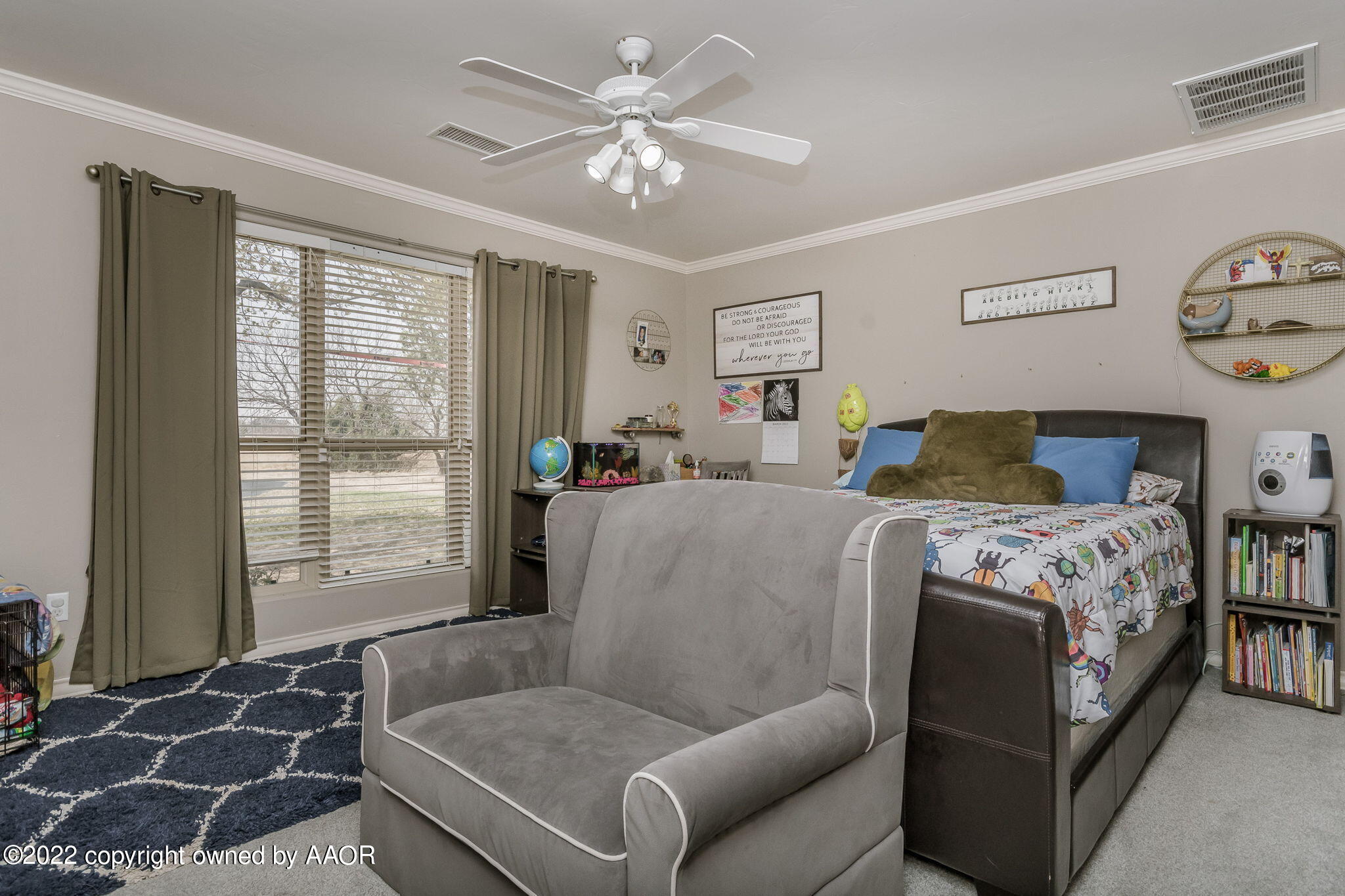 327 Lake Ridge Road Canyon, TX 79015 - Photo 19 of 31 a bedroom with a large bed and a window