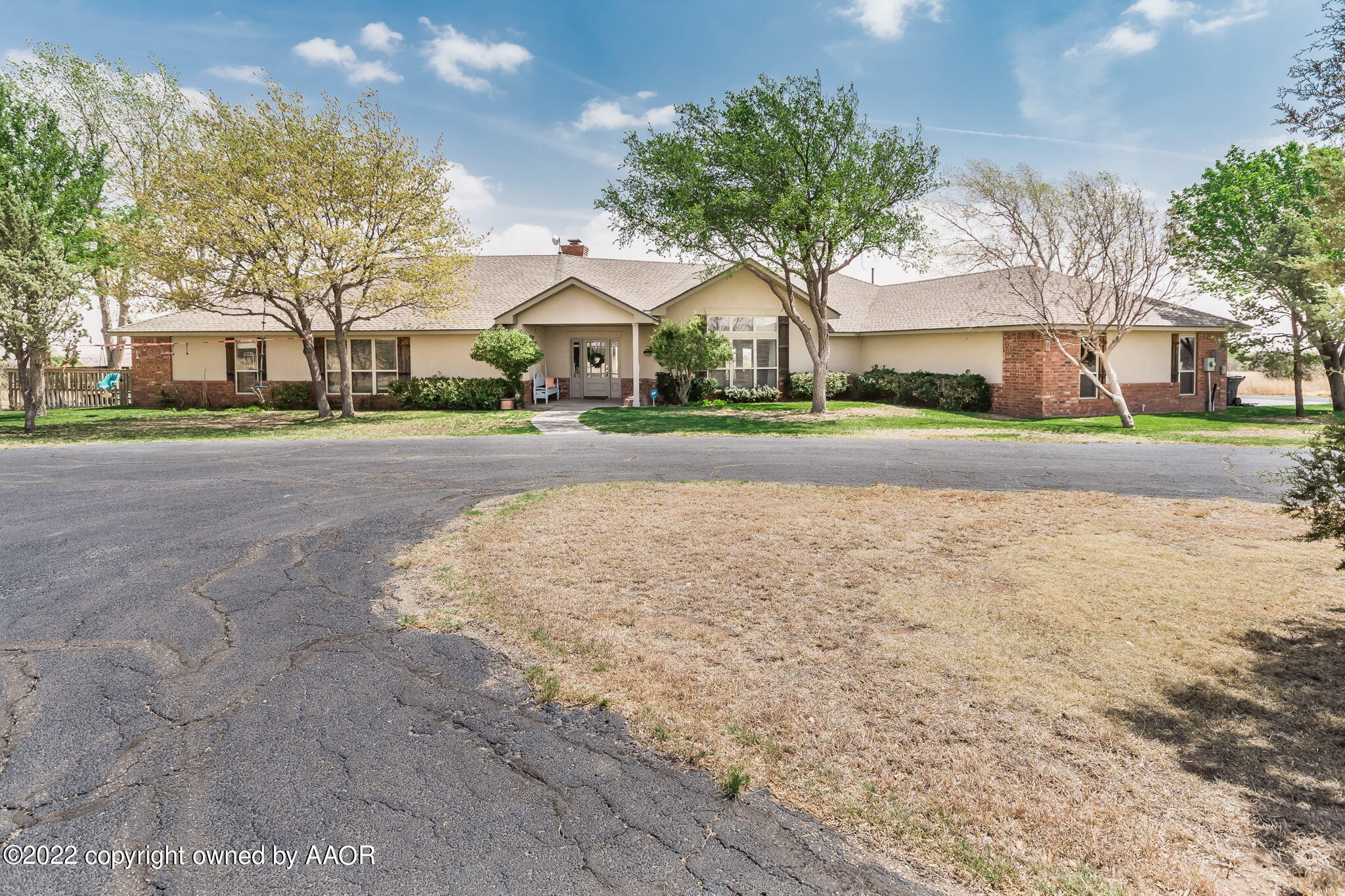 327 Lake Ridge Road Canyon, TX 79015 - Photo 2 of 31 a view of a city street lined with buildings and trees