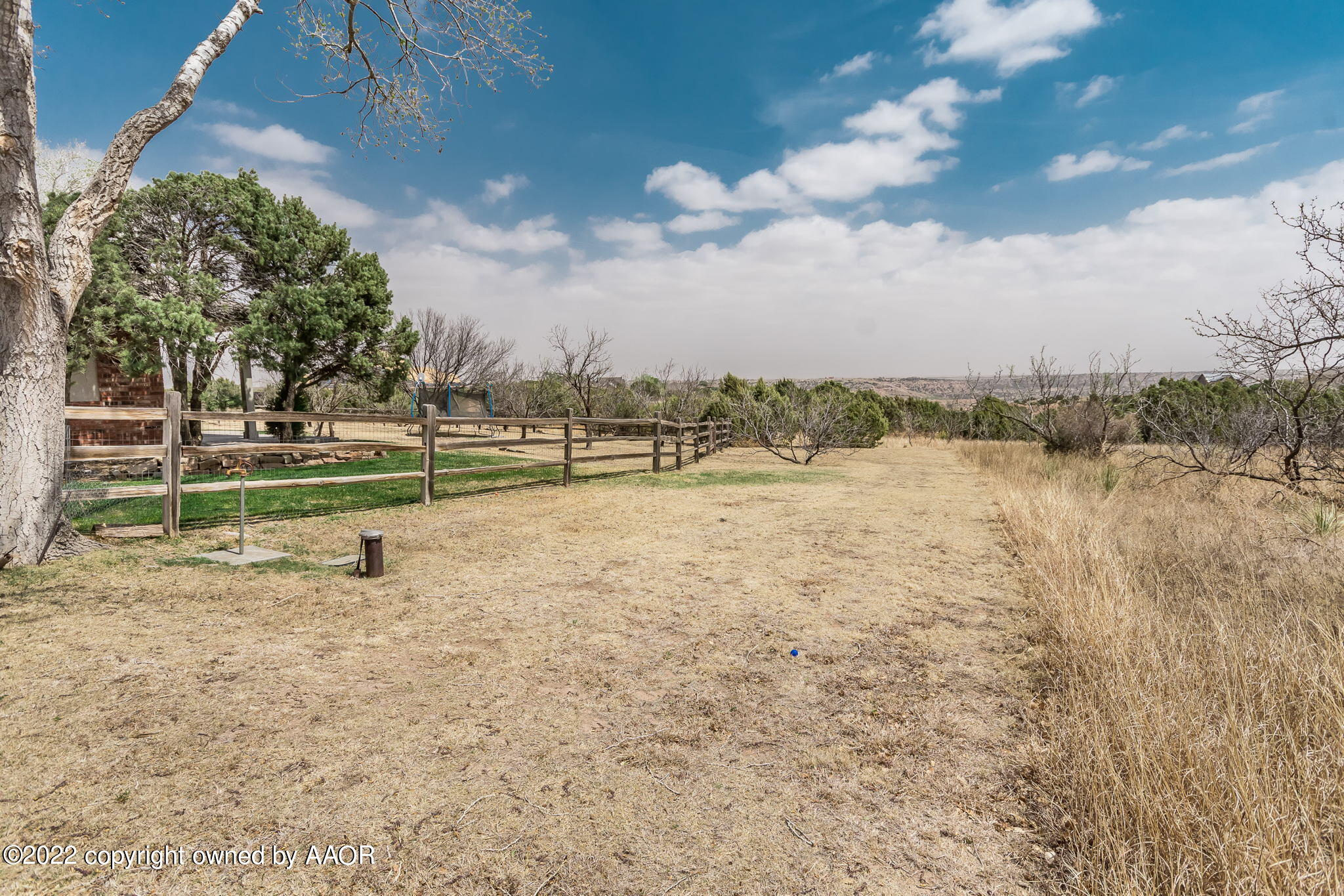 327 Lake Ridge Road Canyon, TX 79015 - Photo 23 of 31 a view of a lake with houses in the background