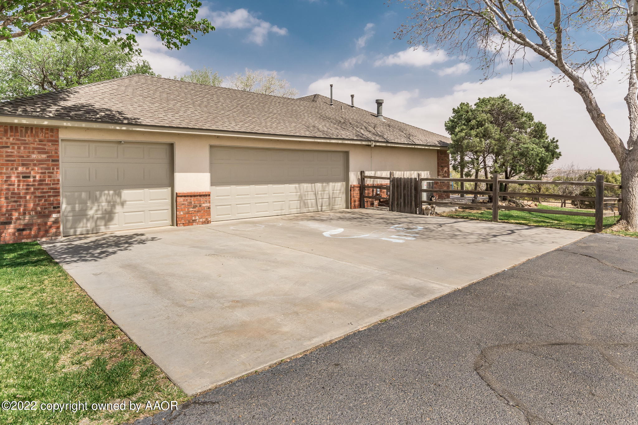 327 Lake Ridge Road Canyon, TX 79015 - Photo 29 of 31 a view of a house with a yard and garage