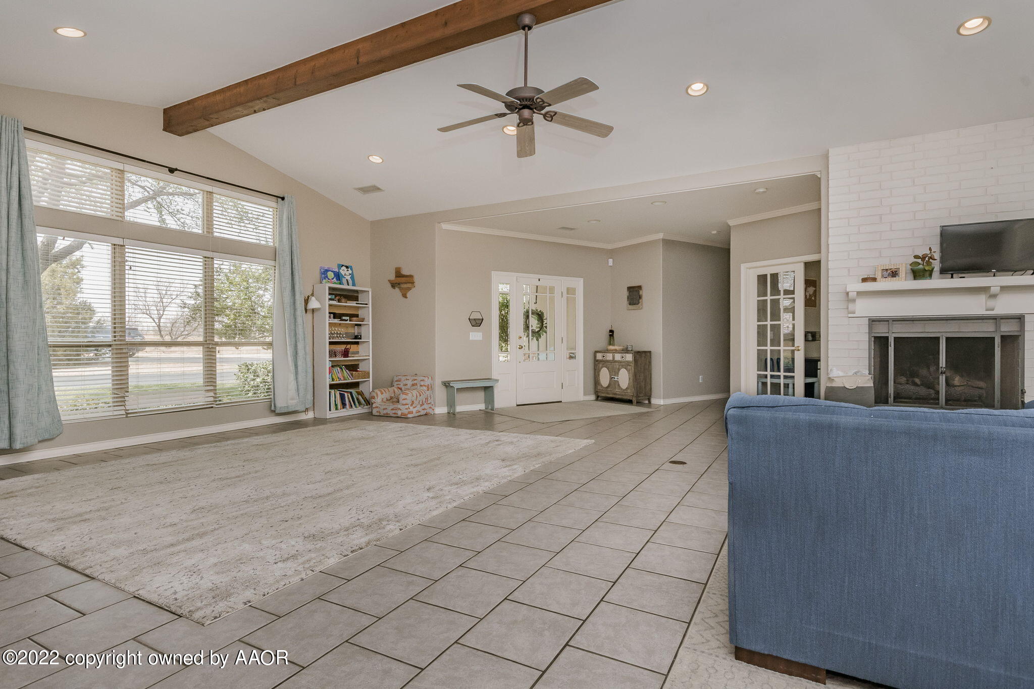 327 Lake Ridge Road Canyon, TX 79015 - Photo 4 of 31 a view of an empty room with a fireplace and a window