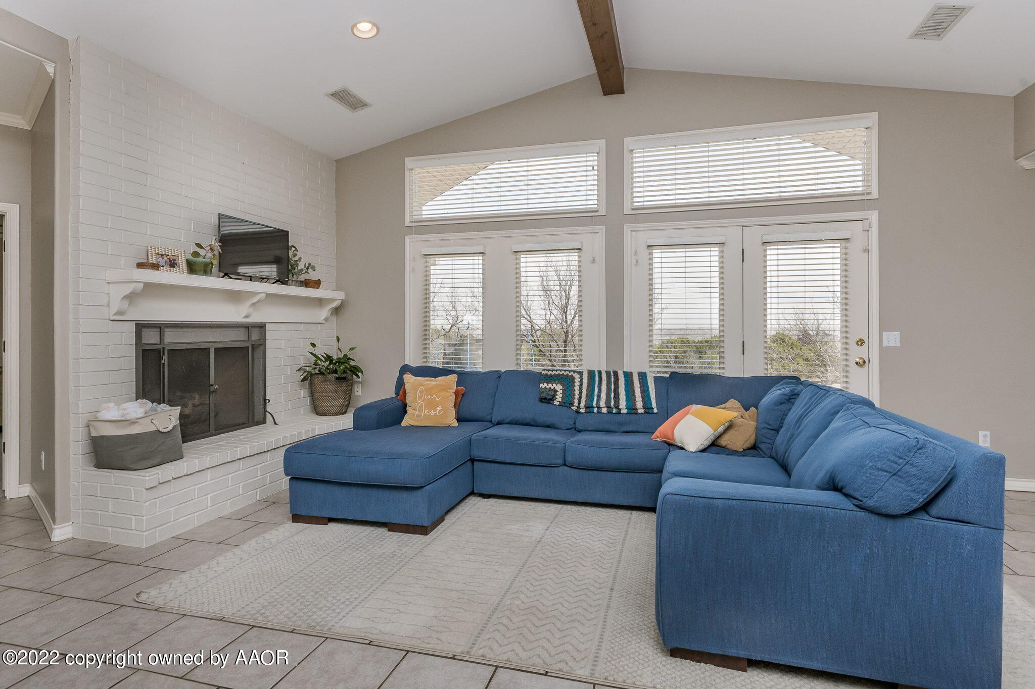 327 Lake Ridge Road Canyon, TX 79015 - Photo 7 of 31 a living room with fireplace furniture and a large window