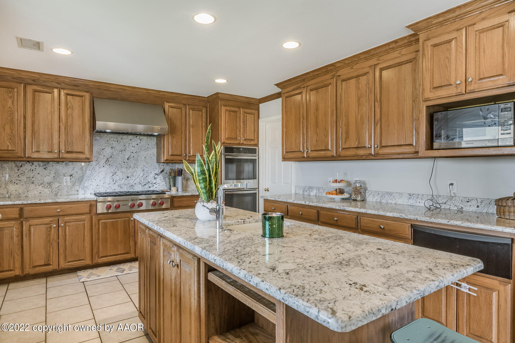 327 Lake Ridge Road Canyon, TX 79015 - Photo 10 of 31 a kitchen with stainless steel appliances granite countertop a sink dishwasher stove refrigerator and cabinets