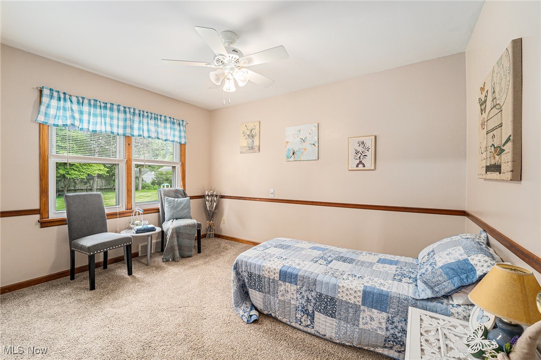194 Prentice Road Painesville, OH 44077 - Photo 6 of 21 Bedroom with carpet and ceiling fan