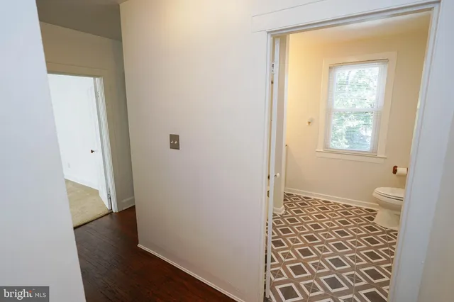 a view of a bathroom from the hallway