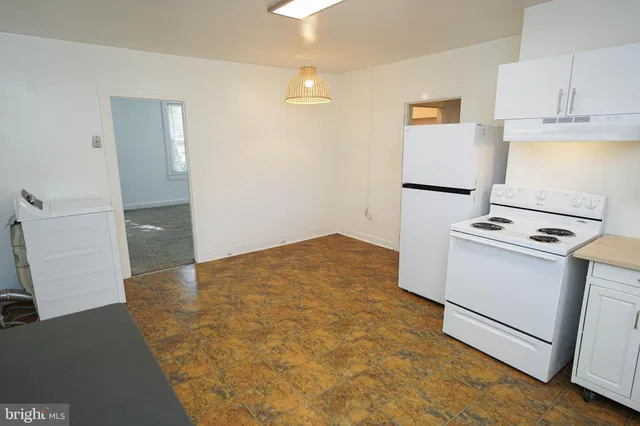 a view of storage and utility room with closet