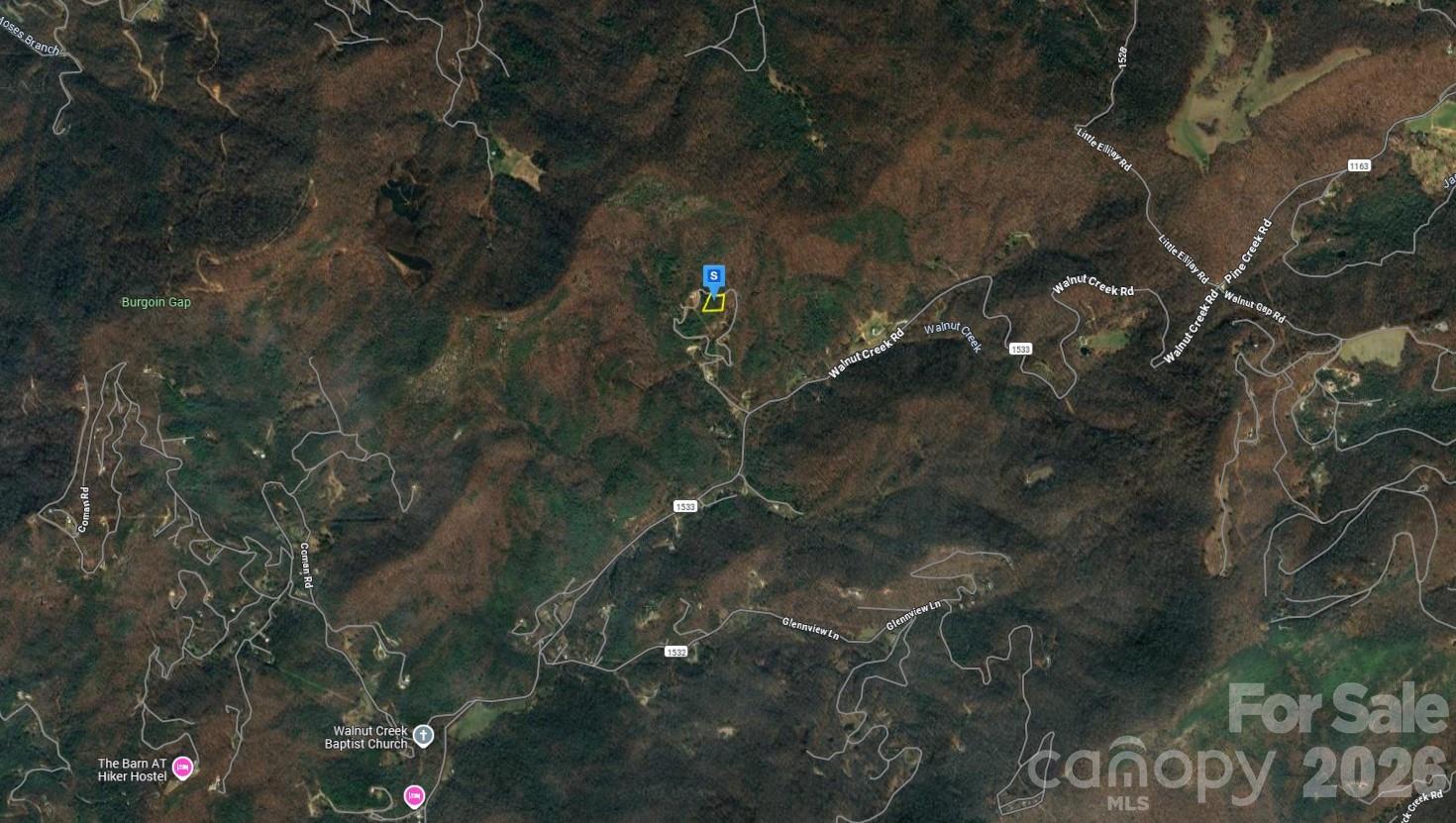 510 Stiwinter Mountain Road Franklin, NC 28734 - Photo 2 of 5 a backyard of a house