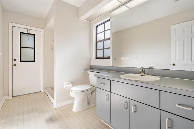a bathroom with a sink a vanity and shower