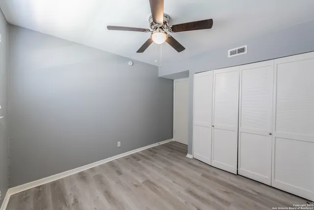an empty room with fan