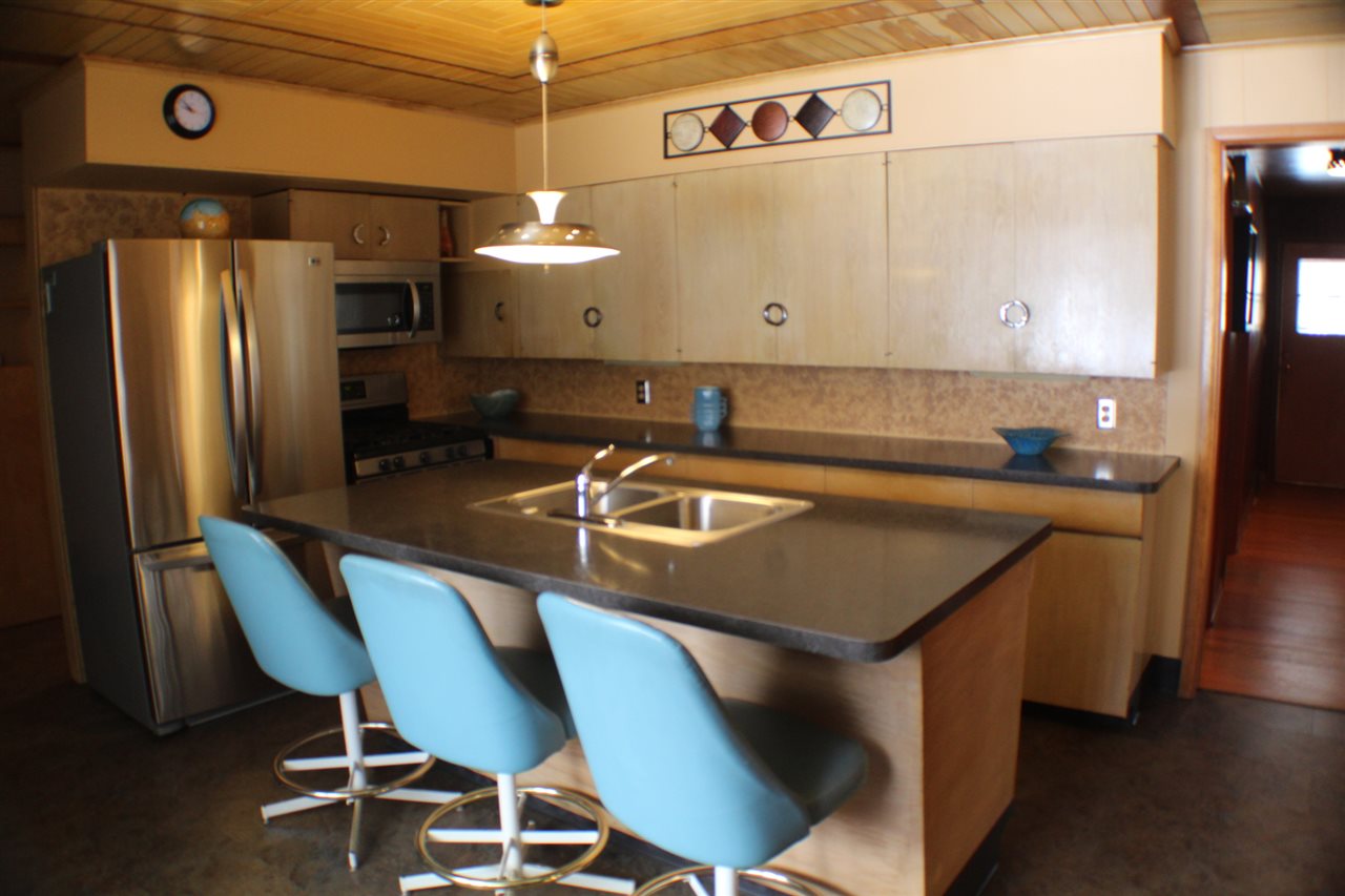 3421 North View Road Rockford, IL 61107 - Photo 3 of 24 a kitchen with a table chairs sink and cabinets