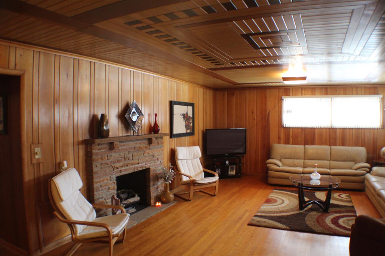 3421 North View Road Rockford, IL 61107 - Photo 7 of 24 a living room with furniture a fireplace and a flat screen tv