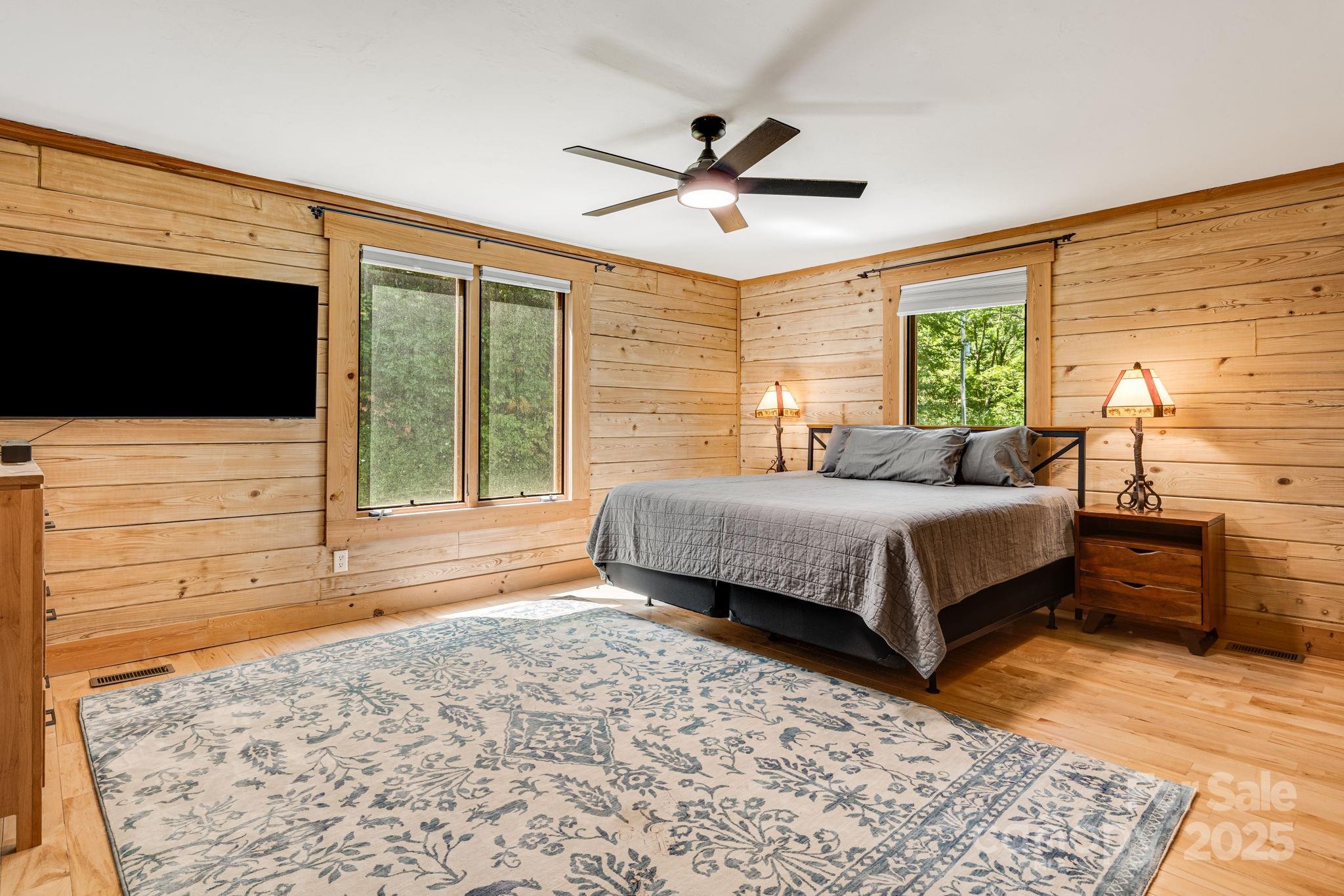 6018 Meadow Fork Road Hot Springs, NC 28743 - Photo 15 of 31 a bedroom with a bed and a flat screen tv