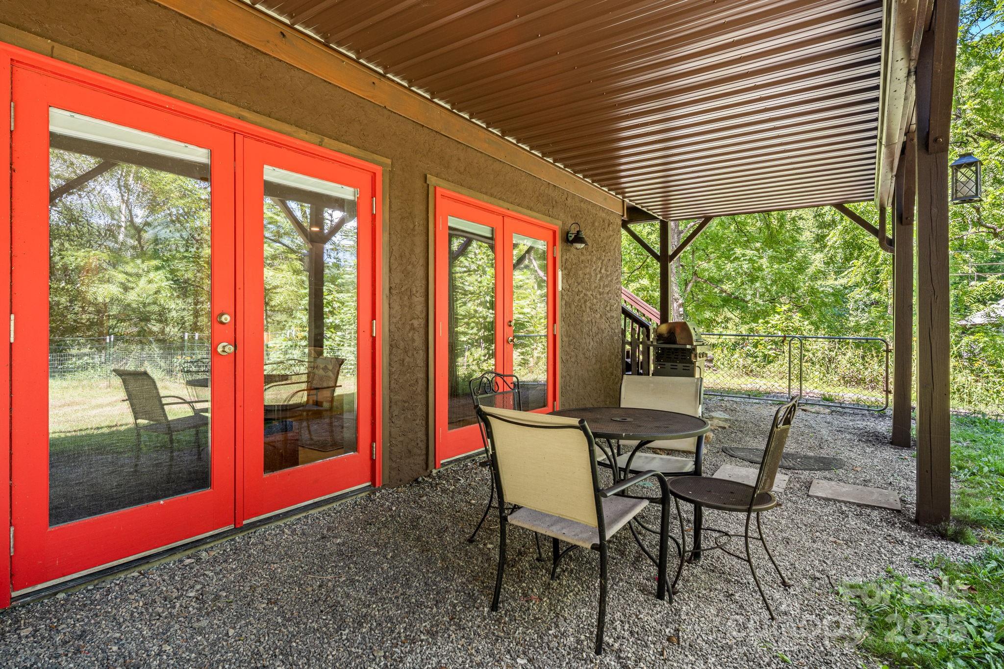 6018 Meadow Fork Road Hot Springs, NC 28743 - Photo 28 of 31 a outdoor dining space with a table and chairs