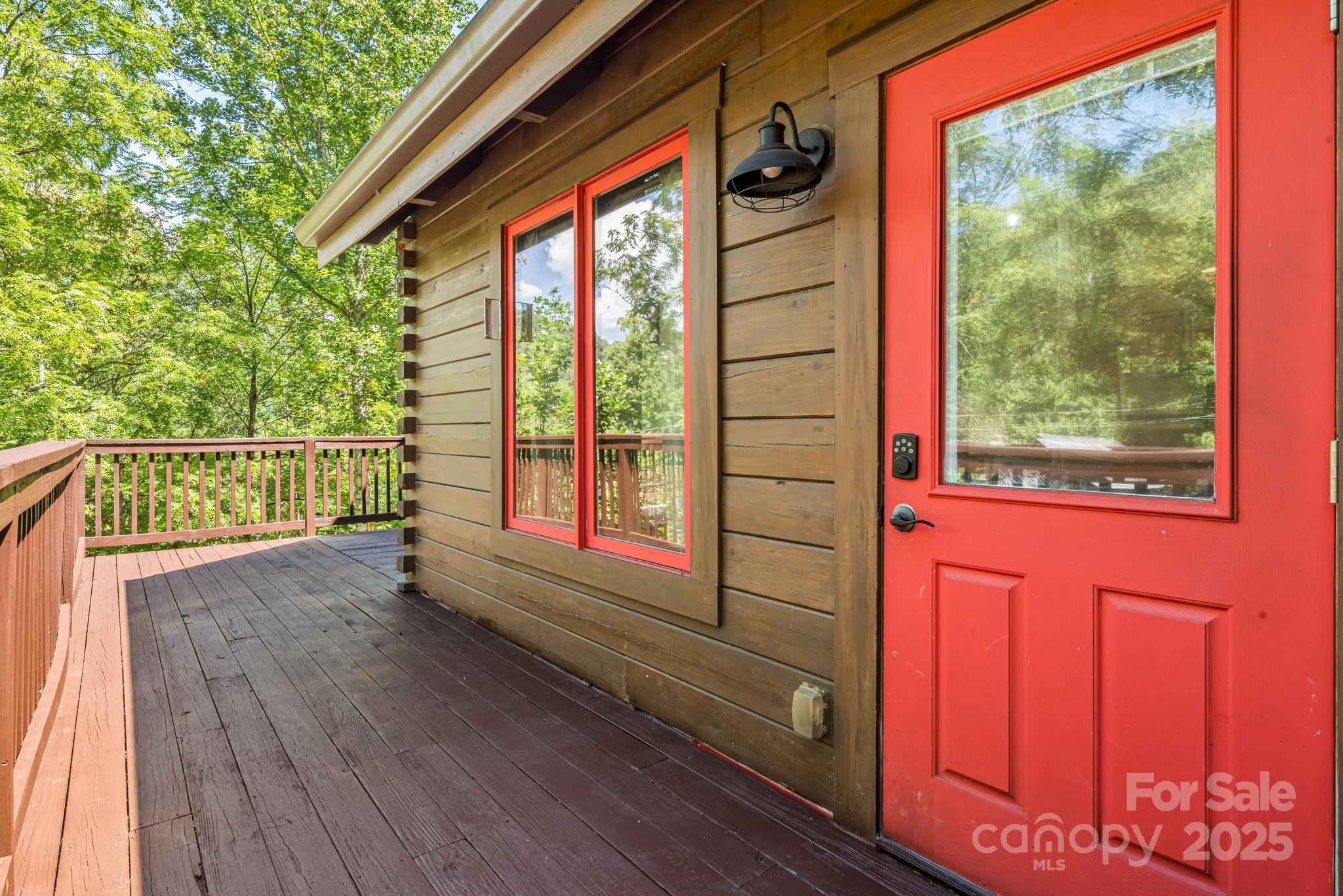 6018 Meadow Fork Road Hot Springs, NC 28743 - Photo 4 of 31 a view of deck with a flat screen tv