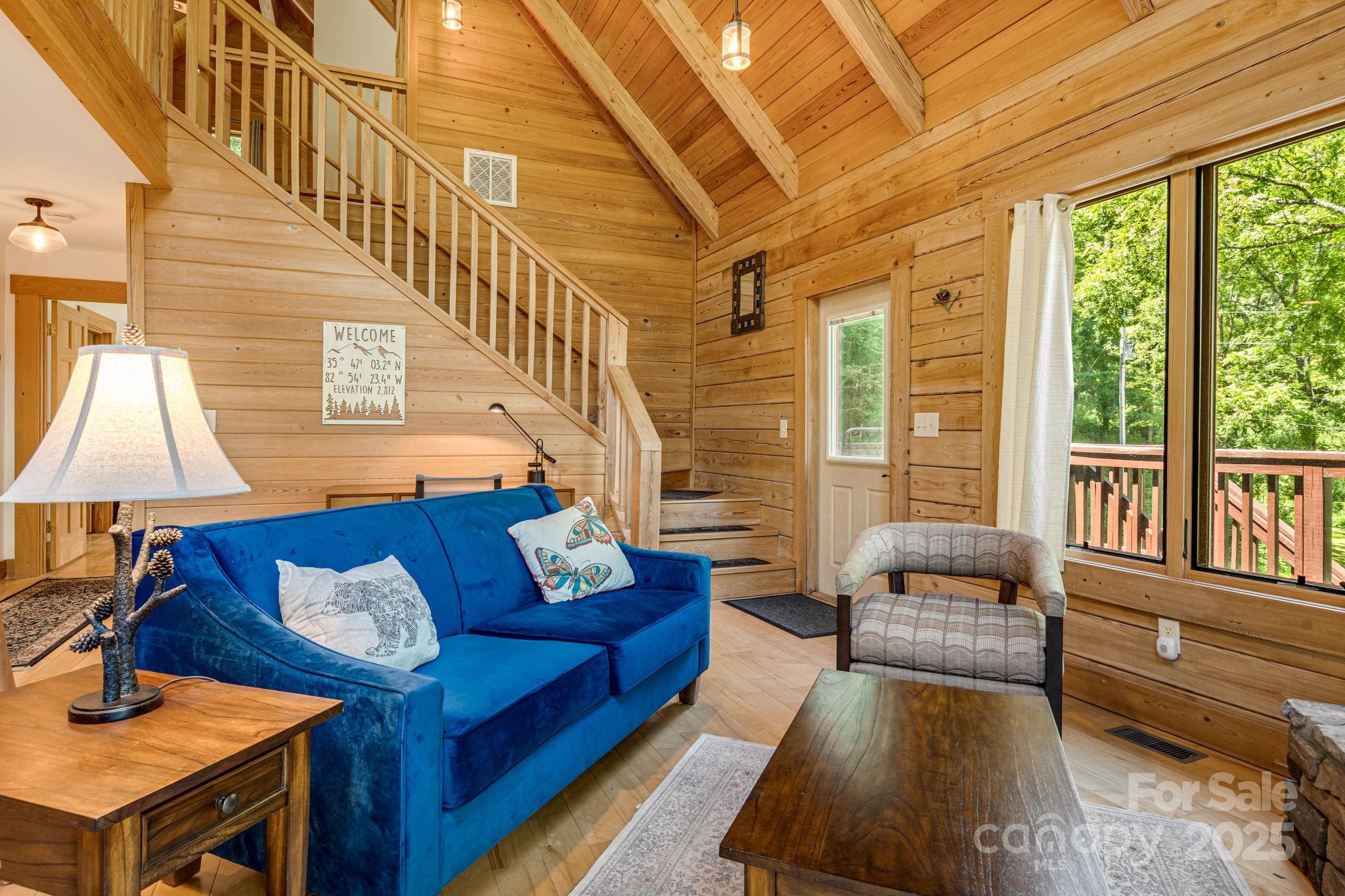 6018 Meadow Fork Road Hot Springs, NC 28743 - Photo 8 of 31 a living room with furniture and a flat screen tv