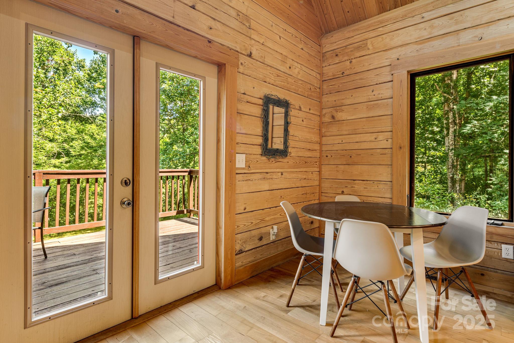 6018 Meadow Fork Road Hot Springs, NC 28743 - Photo 10 of 31 a patio with table and chairs and potted plants