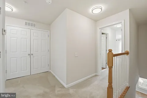 a view of a hallway with a room