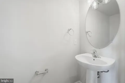 a bathroom with a sink and mirror