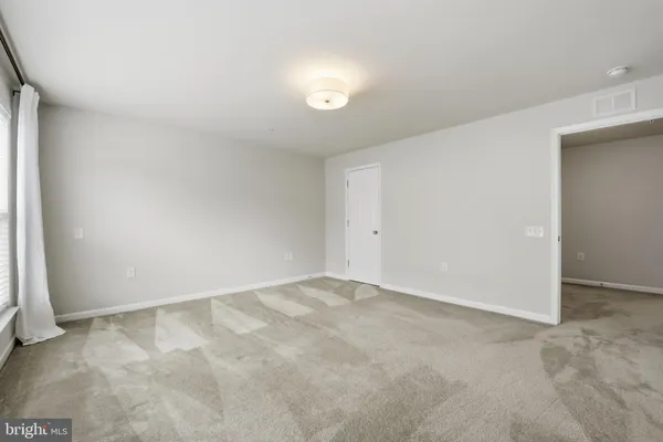 an empty room with a natural light