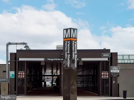 a front view of a building with retail shops