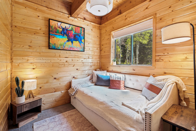 11237 East Aspen Road, Unit 74 Heber City, UT 84032 - Photo 13 of 32 Natural wood paneling throughout, wood-finish flooring, recessed window with wooded scenery, and a ceiling-mounted light fixture