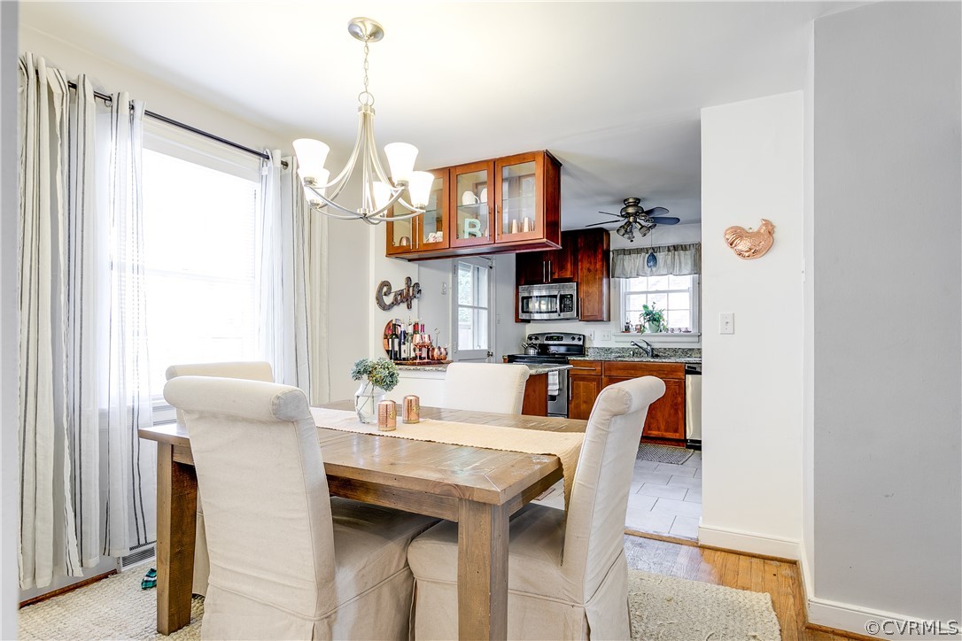 3926 Brook Road Richmond, VA 23227 - Photo 7 of 25 a dining room with furniture and a chandelier