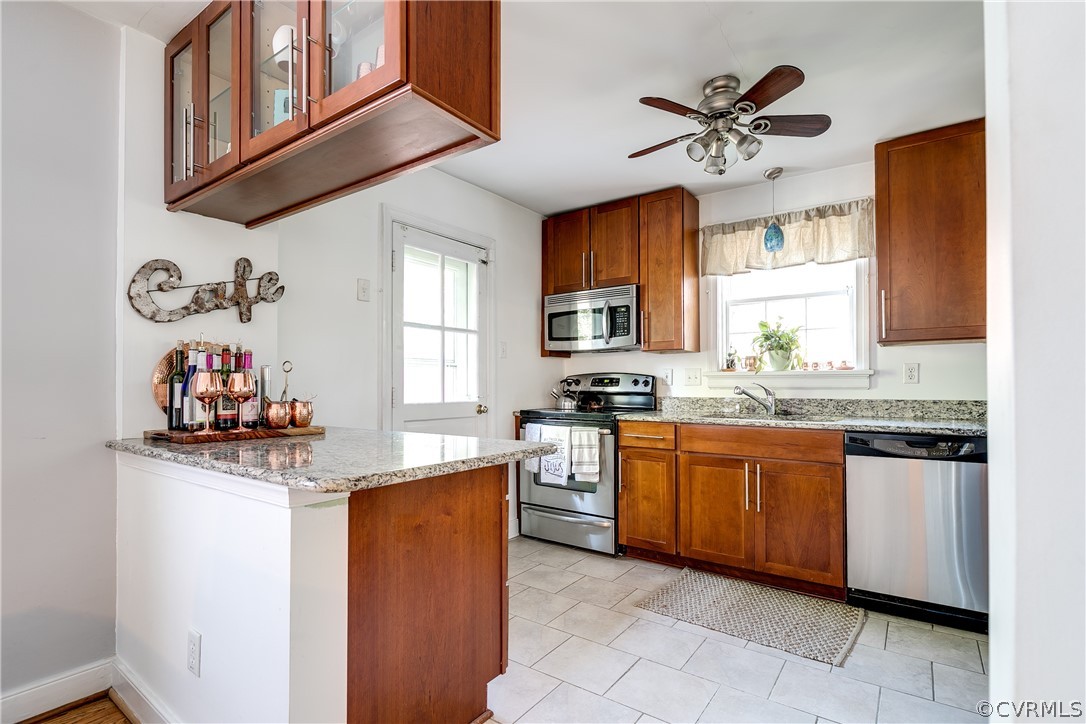 3926 Brook Road Richmond, VA 23227 - Photo 8 of 25 a kitchen with stainless steel appliances granite countertop a sink dishwasher stove and cabinets