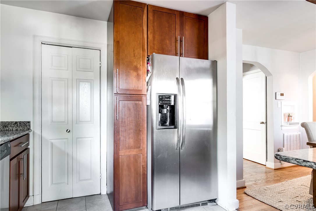 3926 Brook Road Richmond, VA 23227 - Photo 10 of 25 a metallic refrigerator freezer sitting in a kitchen