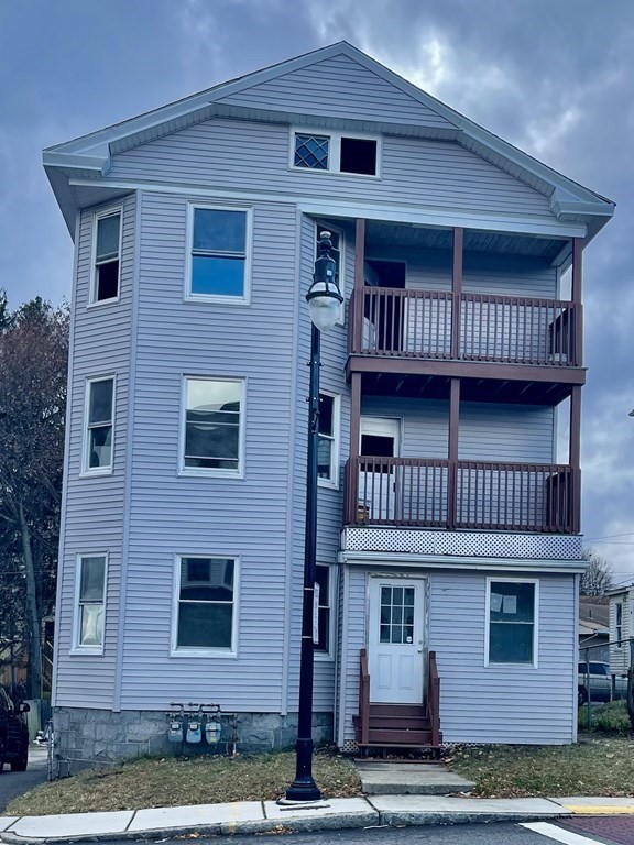 a view of front of a house with balcony