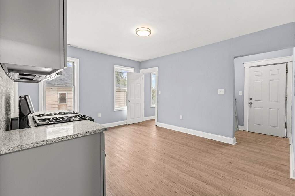 8 Massasoit Road Worcester, MA 01604 - Photo 15 of 21 a kitchen with granite countertop a sink and a stove