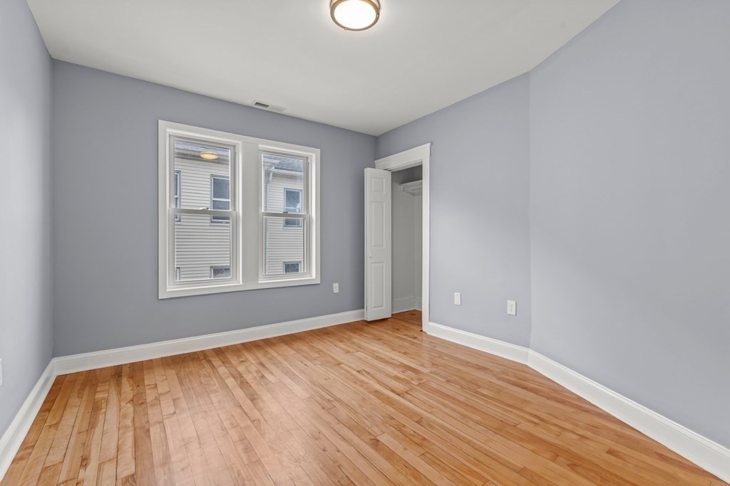 8 Massasoit Road Worcester, MA 01604 - Photo 10 of 21 a view of an empty room with wooden floor with windows
