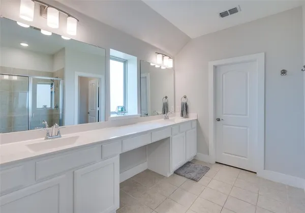 a bathroom with a shower and a toilet