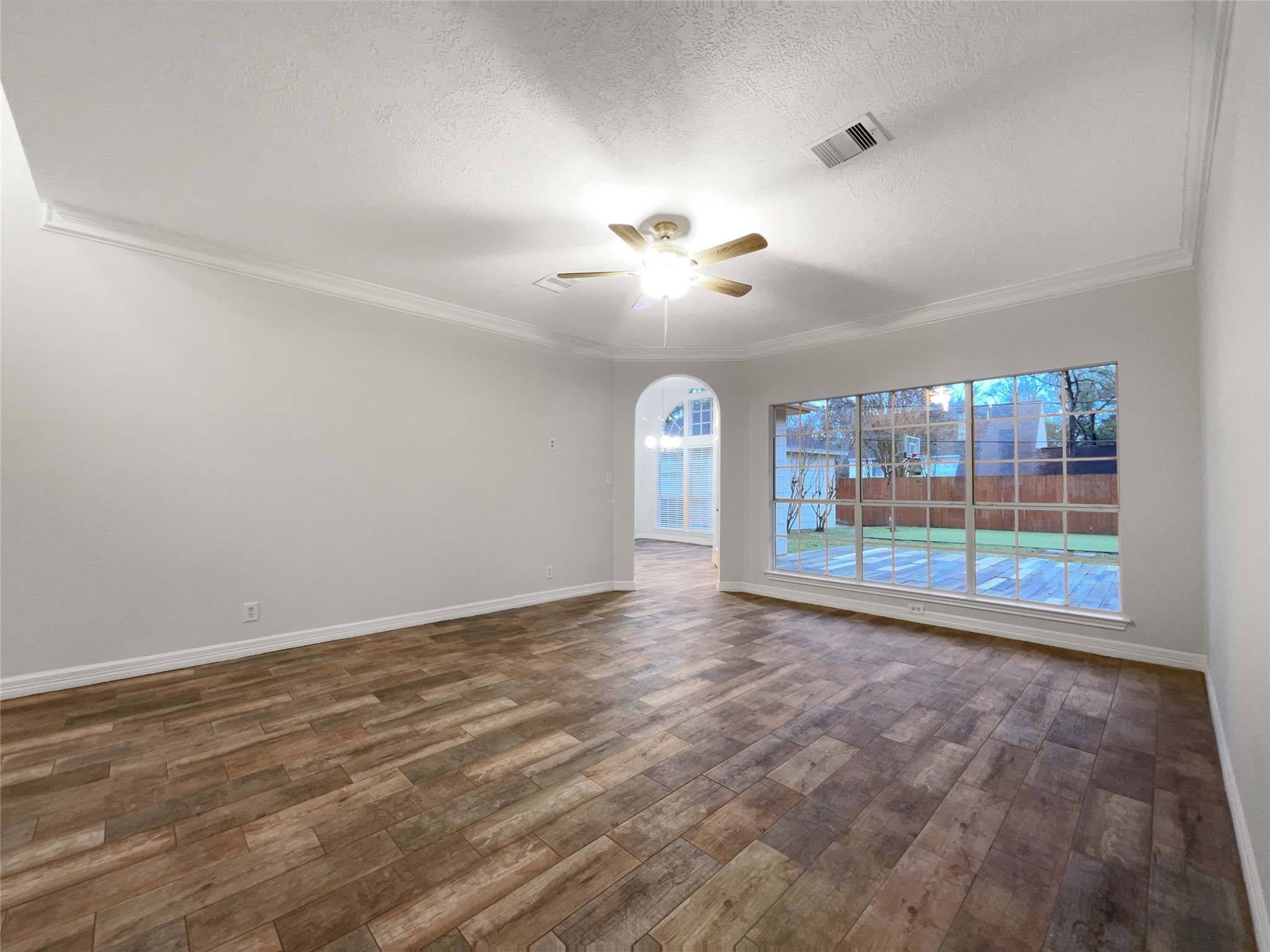 6107 Hampton Way Court Spring, TX 77389 - Photo 11 of 22 wooden floor in an empty room with a window
