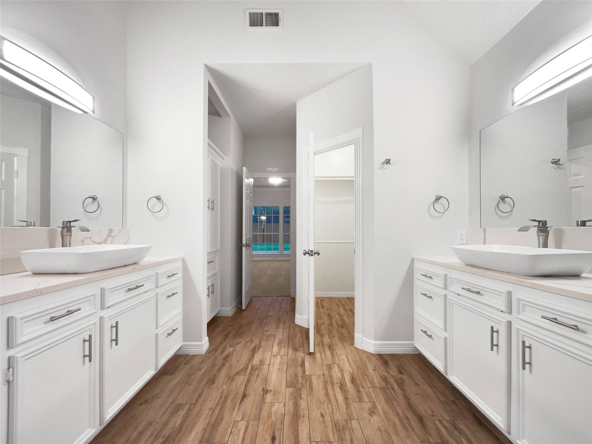 6107 Hampton Way Court Spring, TX 77389 - Photo 14 of 22 a spacious bathroom with a double vanity sink and a mirror