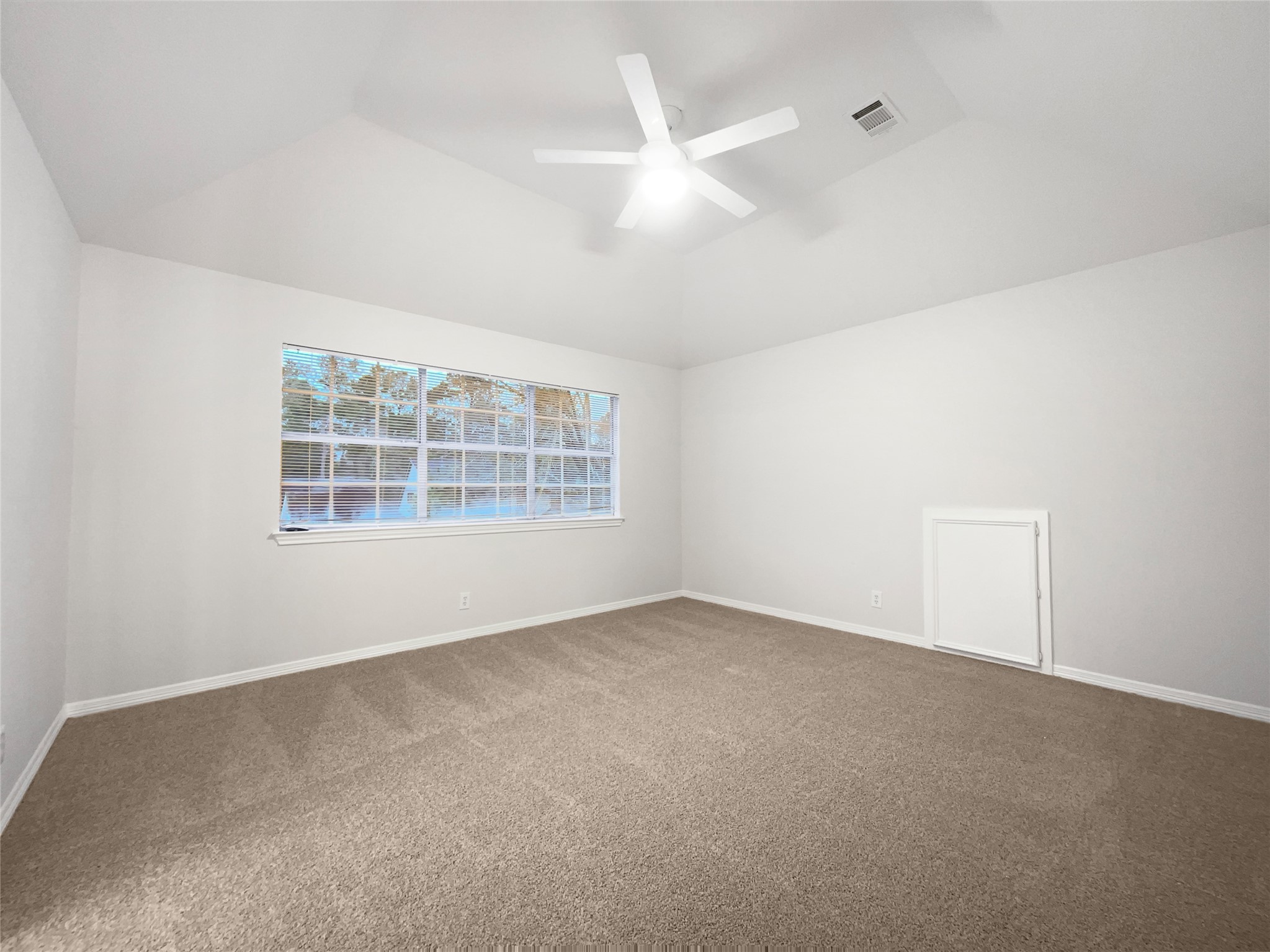 6107 Hampton Way Court Spring, TX 77389 - Photo 16 of 22 an empty room with windows and ceiling fan