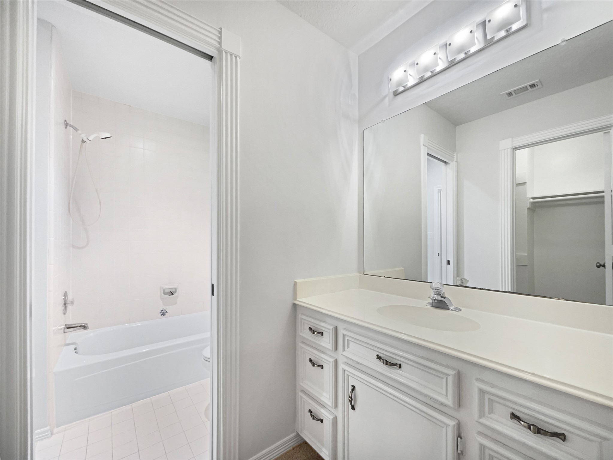 6107 Hampton Way Court Spring, TX 77389 - Photo 21 of 22 a bathroom with a bathtub and a sink