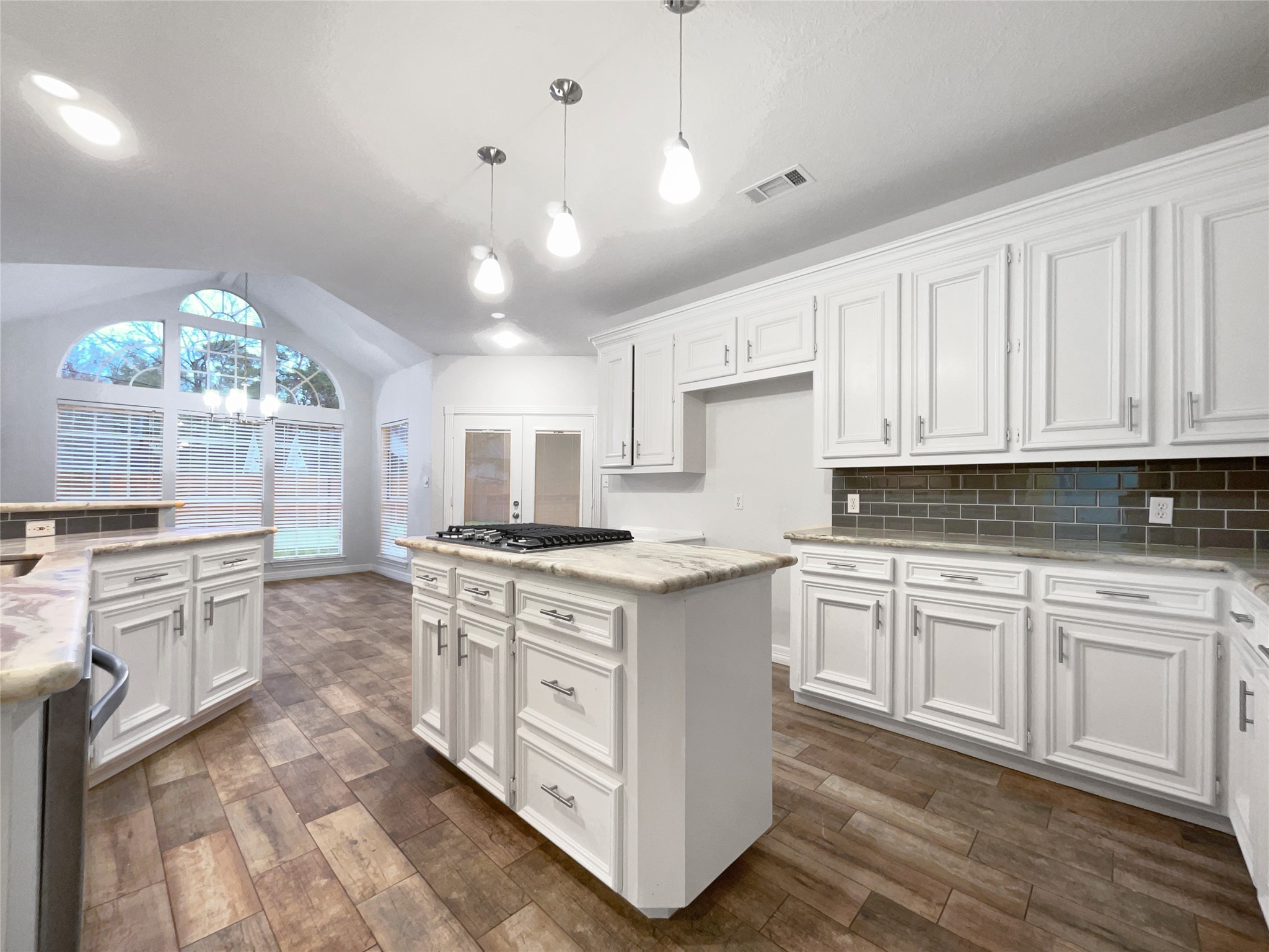 6107 Hampton Way Court Spring, TX 77389 - Photo 9 of 22 a kitchen with white cabinets and sink