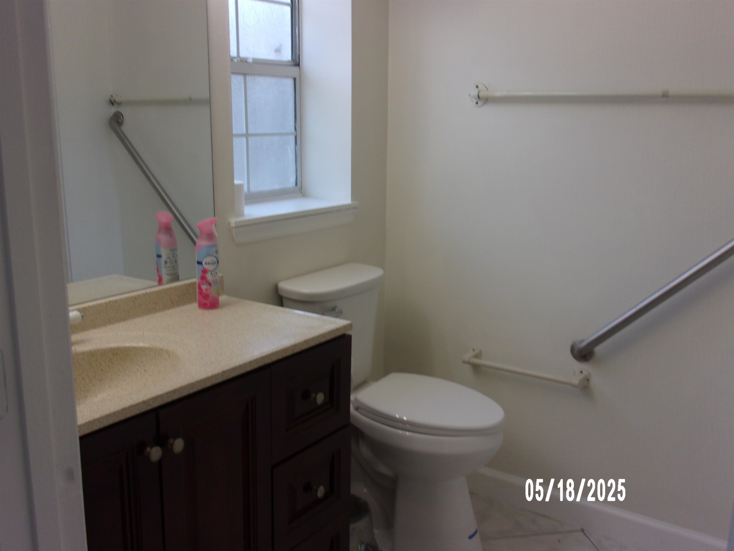 239 Cornell Road St. Augustine, FL 32086 - Photo 12 of 27 a bathroom with a sink a toilet and a window
