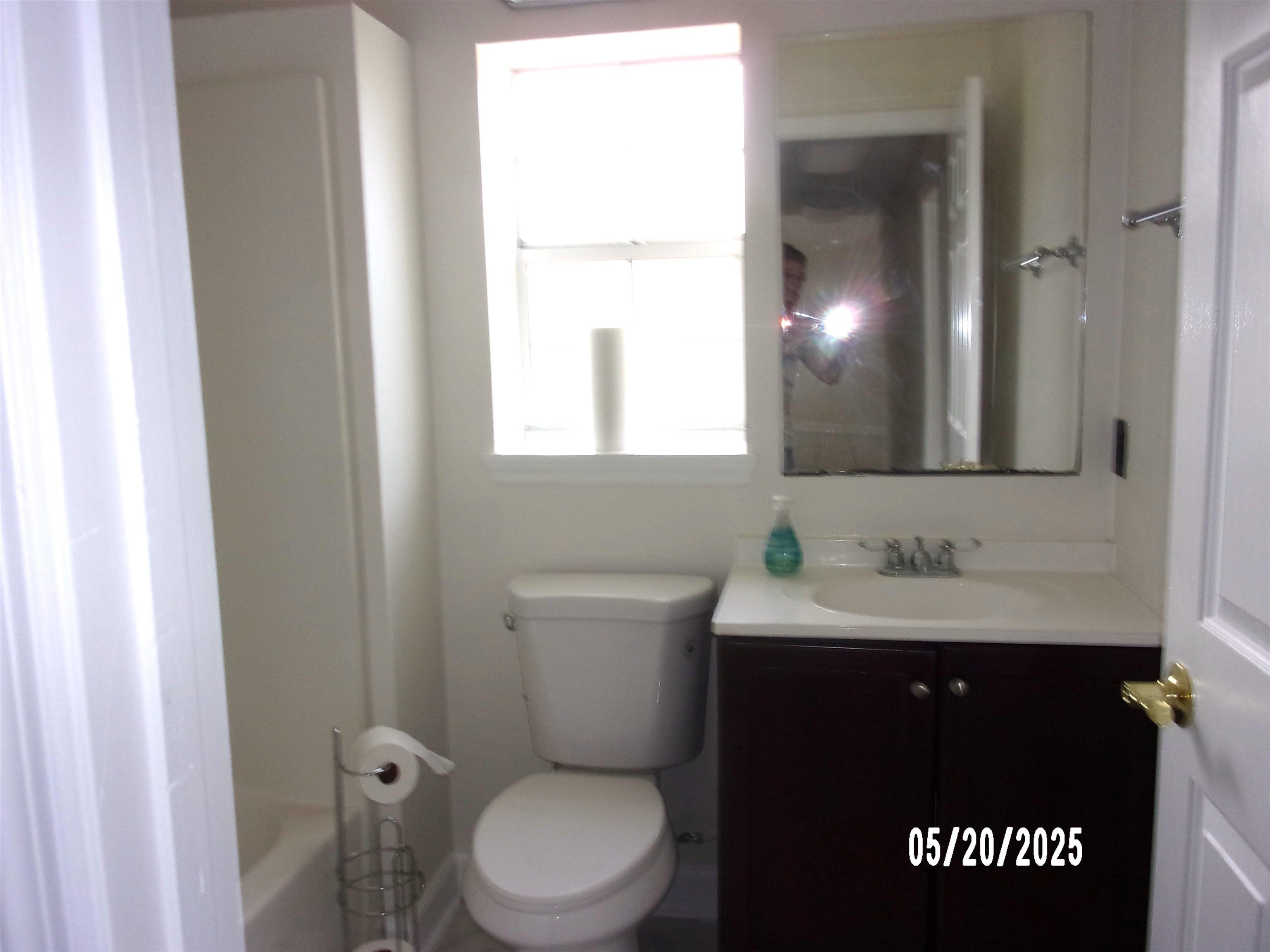 239 Cornell Road St. Augustine, FL 32086 - Photo 18 of 27 a bathroom with a sink a toilet and a mirror