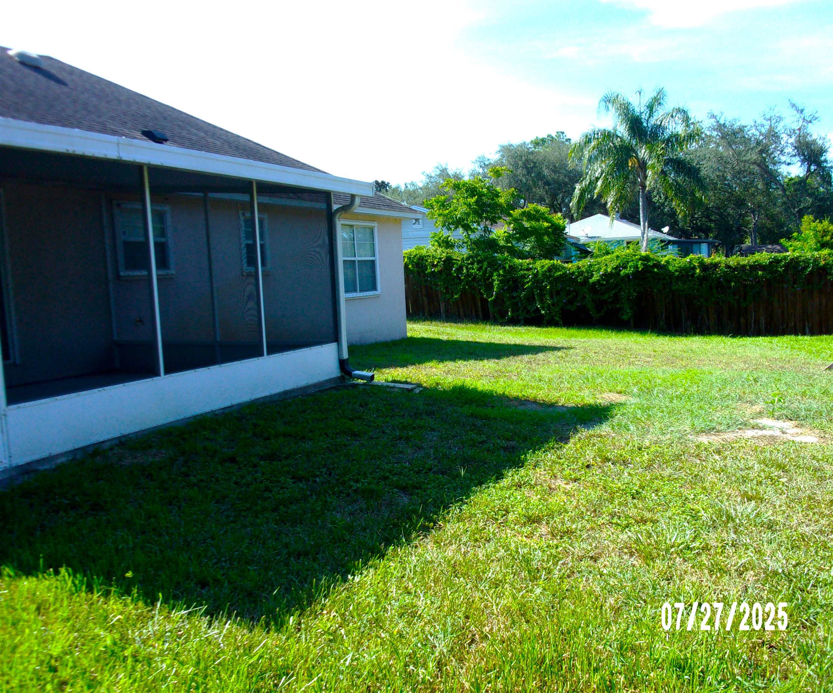 239 Cornell Road St. Augustine, FL 32086 - Photo 22 of 27 a view of a backyard with potted plants and large trees