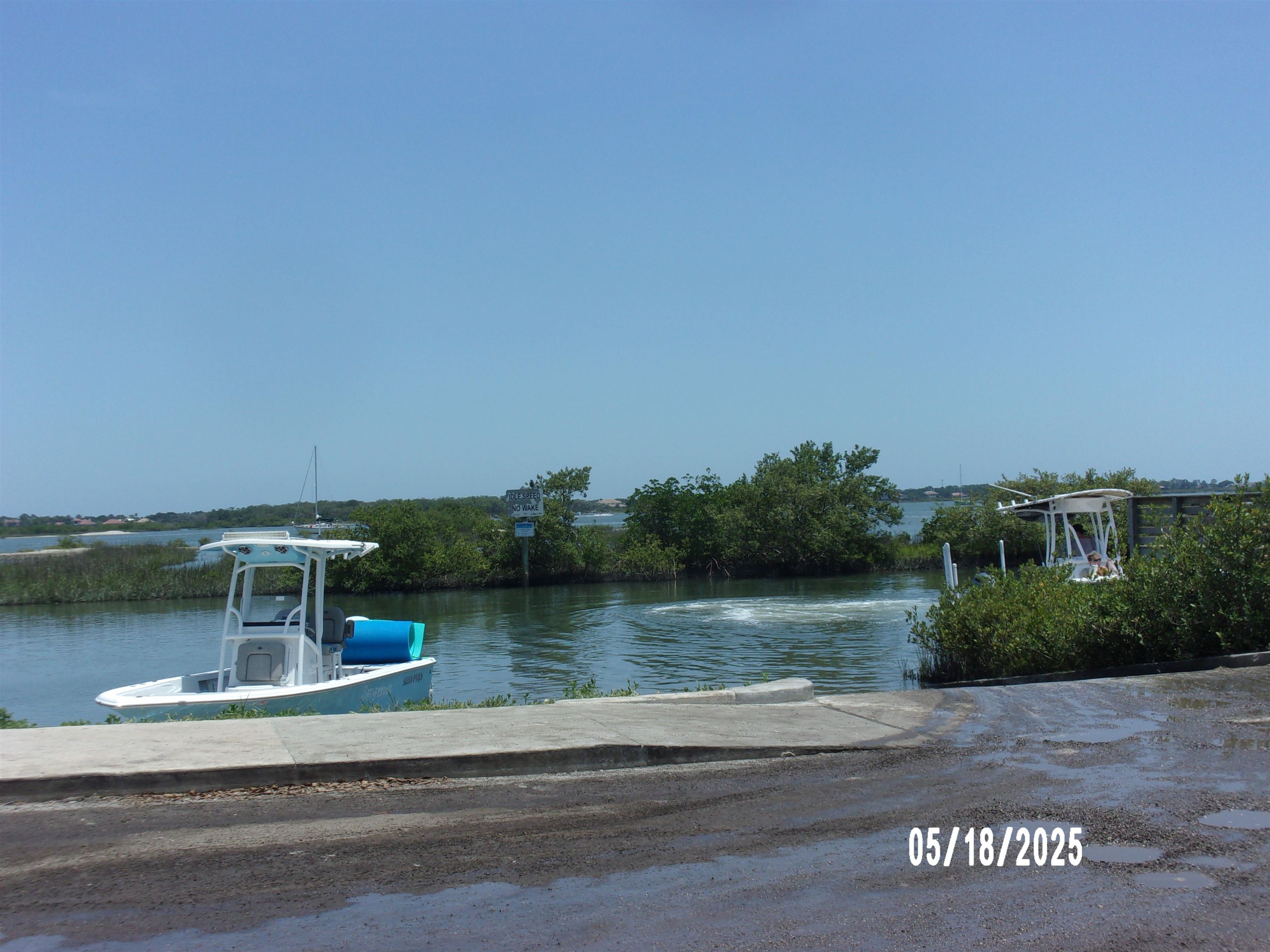 239 Cornell Road St. Augustine, FL 32086 - Photo 26 of 27 a view of a house with a yard from a lake view