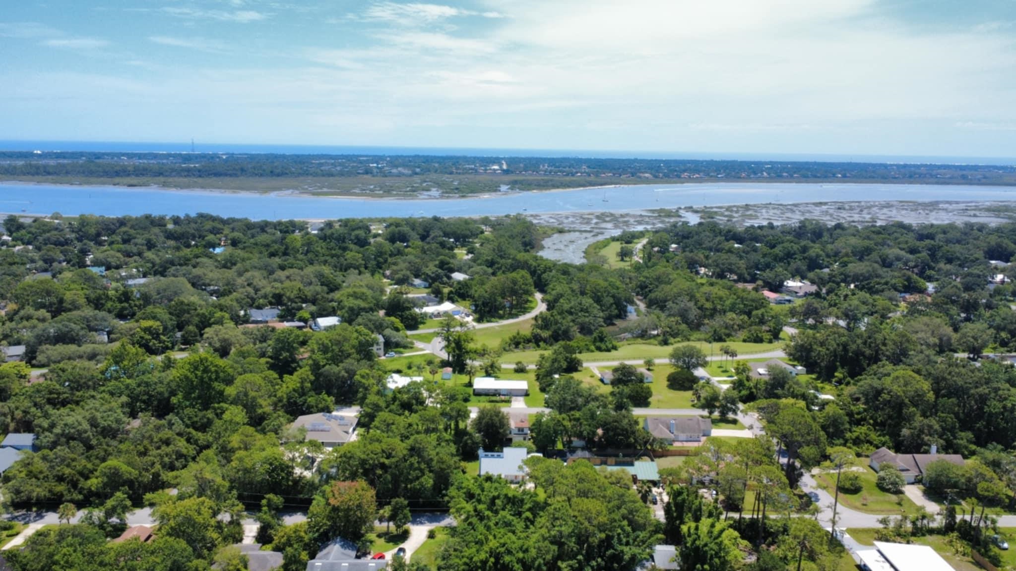 239 Cornell Road St. Augustine, FL 32086 - Photo 3 of 27 an aerial view of a city and mountain