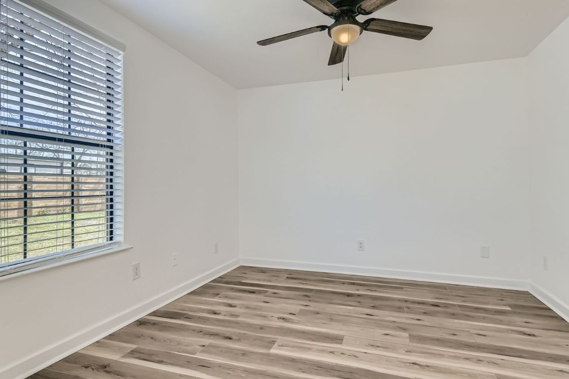 902 Hackberry Street Taylor, TX 76574 - Photo 15 of 18 a view of a room with a window and a ceiling fan