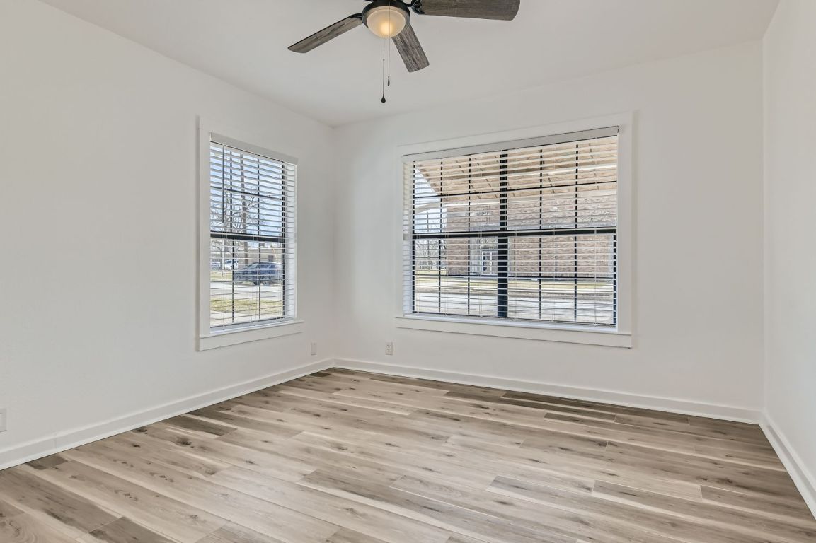 902 Hackberry Street Taylor, TX 76574 - Photo 20 of 29 Unfurnished room with light wood finished floors and a ceiling fan