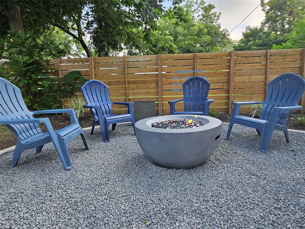 902 Hackberry Street Taylor, TX 76574 - Photo 2 of 18 a view of a backyard with table and chairs