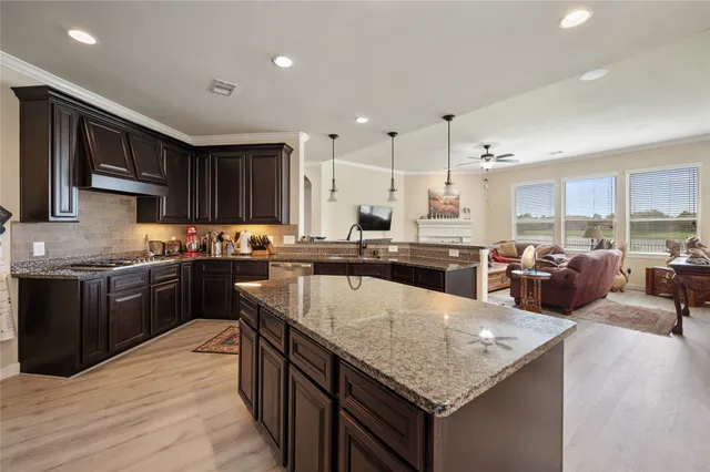 a large kitchen with a center island and appliances
