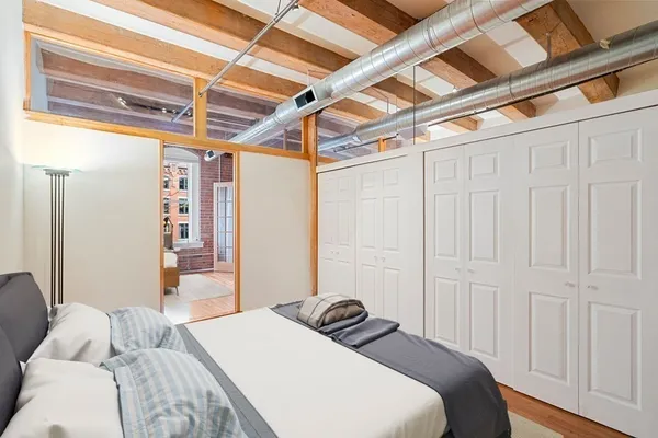 a bedroom with a bed and a walk in closet