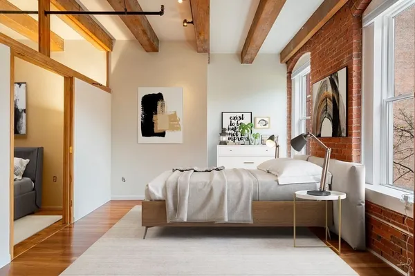 a bedroom with bed and window